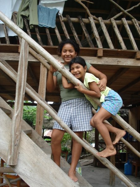 Two Kichwa kids smiling for the camera.