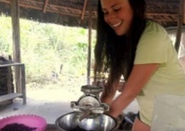 A female traveller making chocolate.